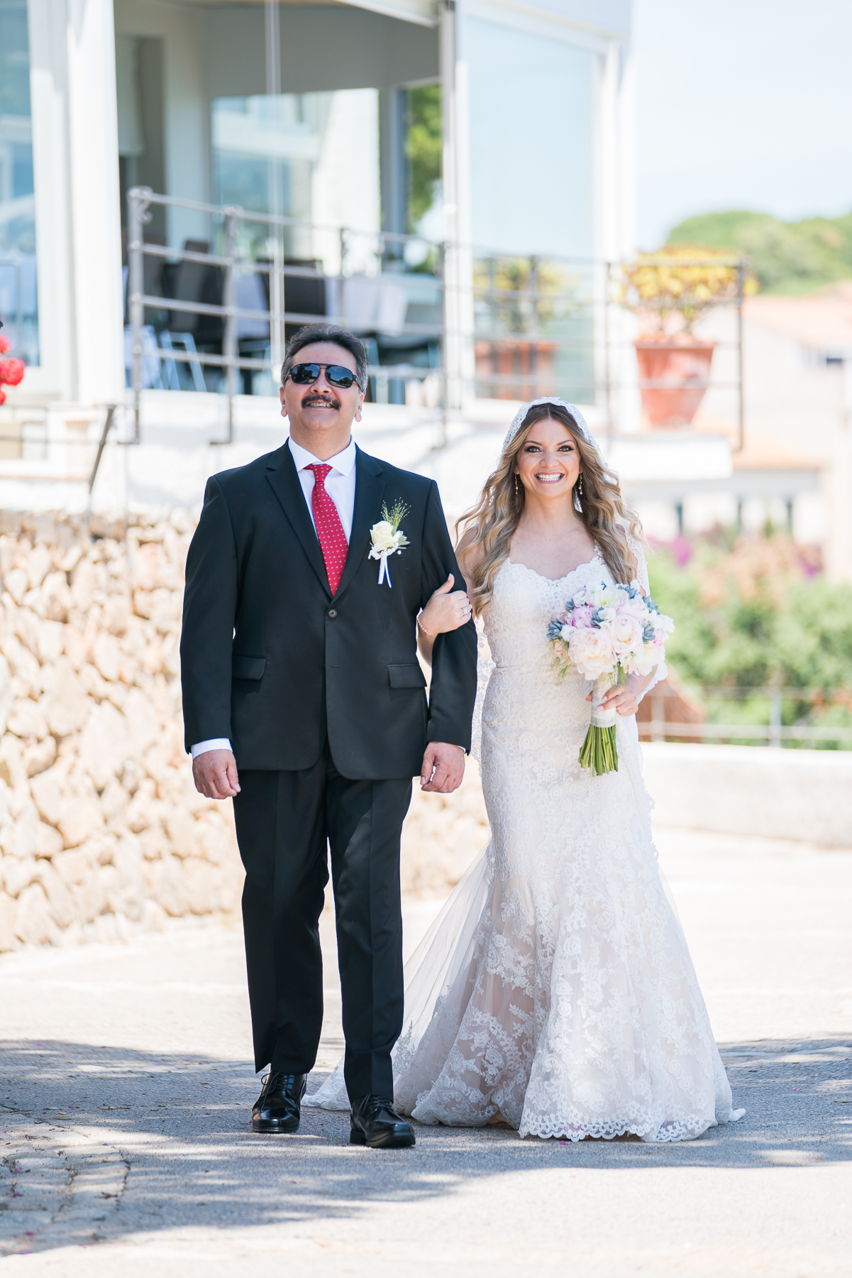 father and daughter walking down the aisle