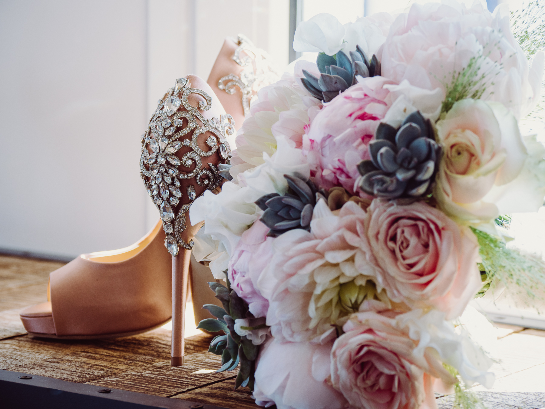 pink wedding shoes and bridal bouquet